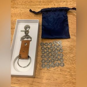 The Wander Club Baseball Glove Keychain with all 30 MLB Stadium Tokens